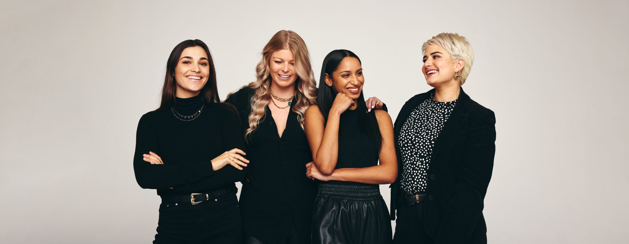 Four women standing, mentorship program
